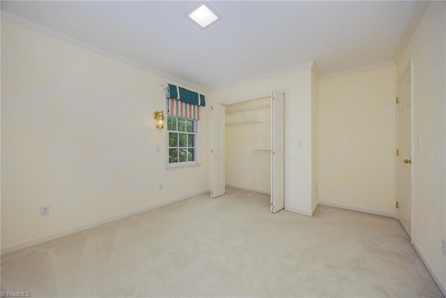 1808 Dunleith Way, Greensboro, NC 27455 - unfurnished bedroom with ornamental molding, carpet floors, baseboards, and a closet