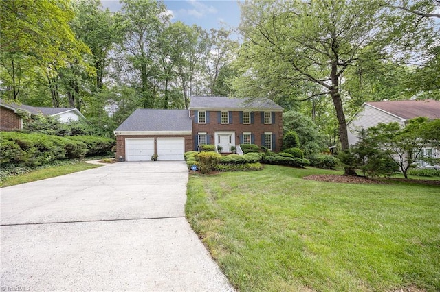 1808 Dunleith Way, Greensboro, NC 27455 - colonial-style house featuring an attached garage, concrete driveway, a front yard, and brick siding