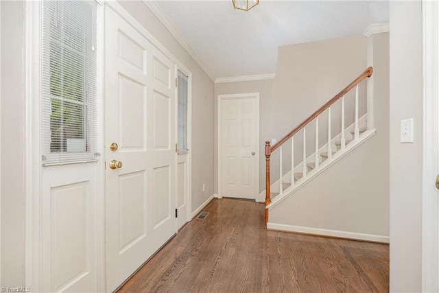 1808 Dunleith Way, Greensboro, NC 27455 - entryway with crown molding, wood finished floors, stairs, and baseboards