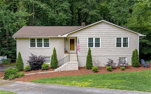 615 Valleybrook Ln, Winston-Salem, NC 27104 - view of front of property featuring a chimney, a front yard, and brick siding