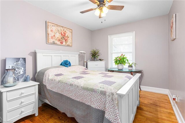 422 Hyde St, Burlington, NC 27217 - bedroom featuring baseboards, light wood-style flooring, and a ceiling fan