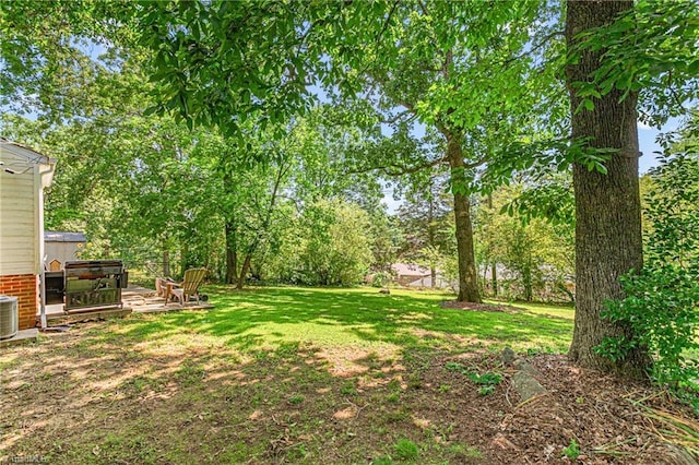 422 Hyde St, Burlington, NC 27217 - view of grassy yard featuring central air condition unit