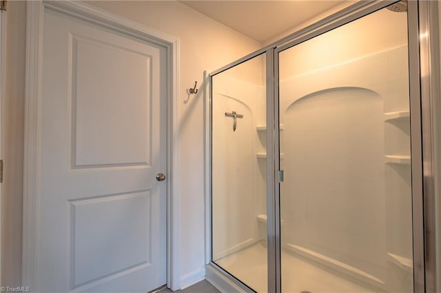 full bathroom with a shower stall