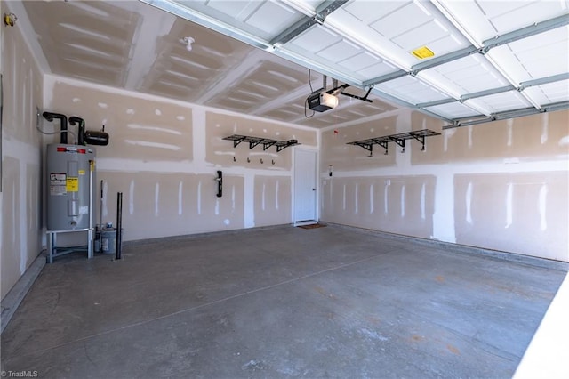 garage with water heater and a garage door opener