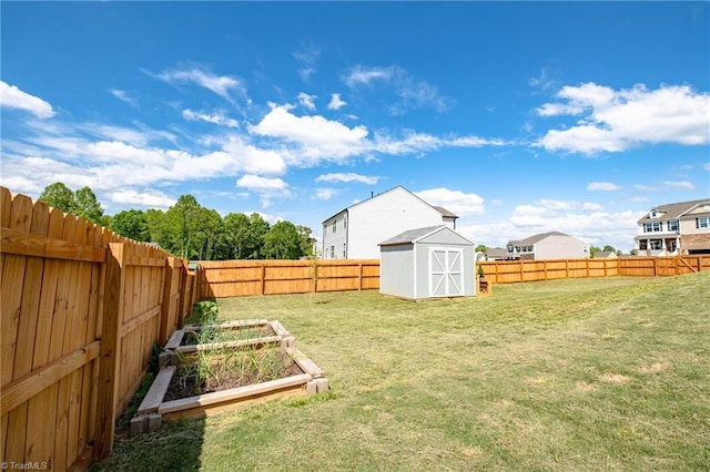 view of yard with a storage unit, a garden, and an outdoor structure