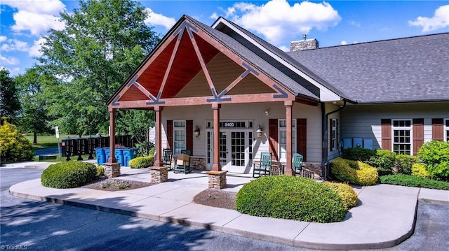 3661 Tyburn Trce, Browns Summit, NC 27214 - craftsman-style house with a chimney, roof with shingles, and stone siding