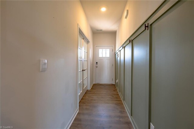 3661 Tyburn Trce, Browns Summit, NC 27214 - hall featuring wood finished floors and baseboards