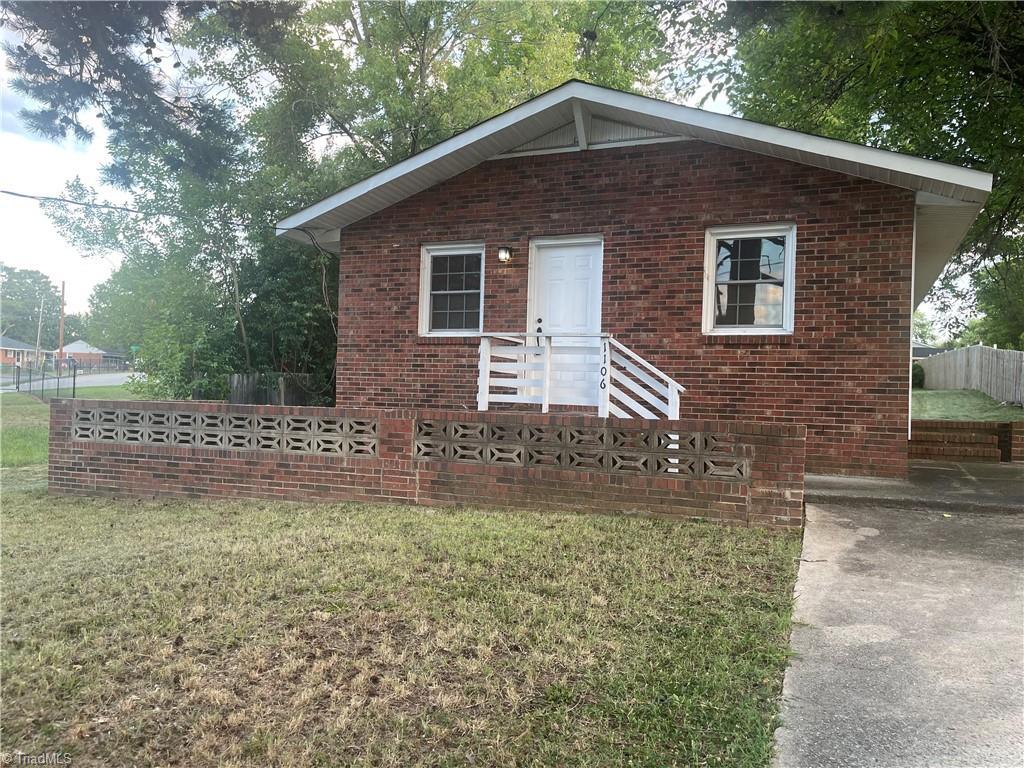 bungalow with a front lawn