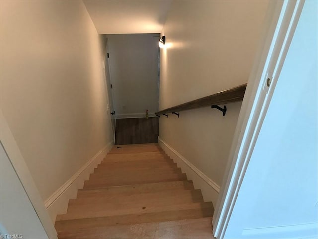 stairs with light hardwood / wood-style flooring