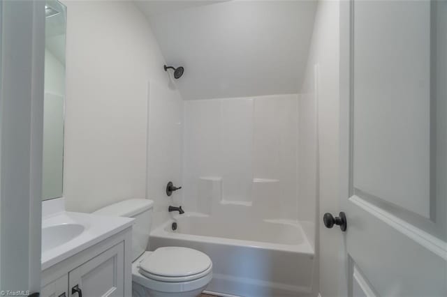 full bathroom with toilet, bathing tub / shower combination, and vanity with extensive cabinet space