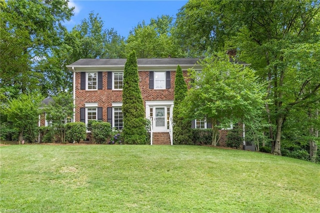 3717 Rock Haven Dr, Greensboro, NC 27410 - colonial inspired home with a front yard and brick siding