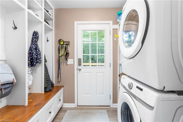 3717 Rock Haven Dr, Greensboro, NC 27410 - laundry area featuring stacked washer / drying machine and light wood-type flooring