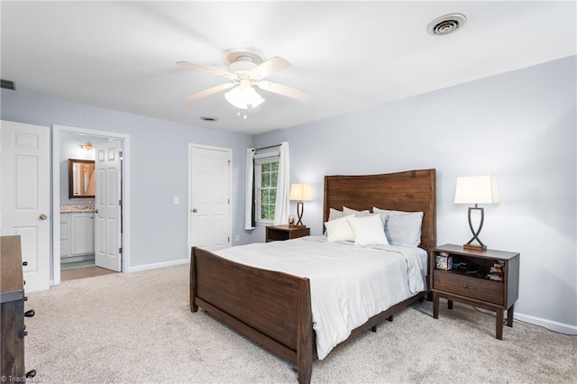 3717 Rock Haven Dr, Greensboro, NC 27410 - bedroom featuring light colored carpet, ensuite bath, and ceiling fan