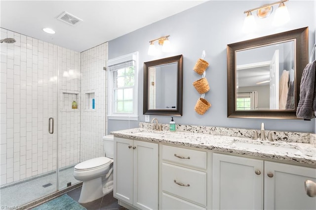 3717 Rock Haven Dr, Greensboro, NC 27410 - full bath featuring a shower stall, double vanity, and tile patterned flooring