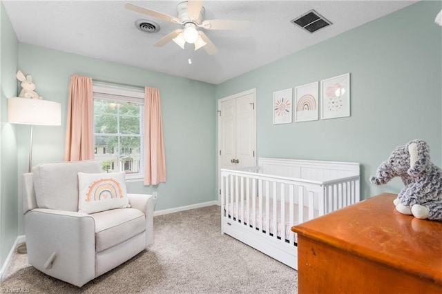 3717 Rock Haven Dr, Greensboro, NC 27410 - carpeted bedroom with a nursery area and a ceiling fan