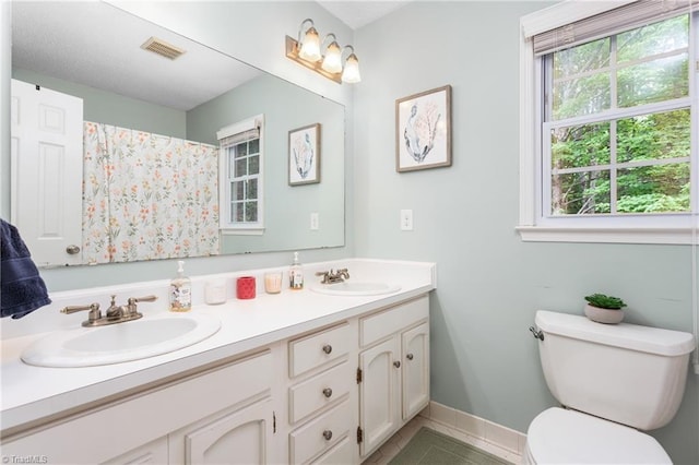 3717 Rock Haven Dr, Greensboro, NC 27410 - bathroom featuring double vanity and tile patterned flooring