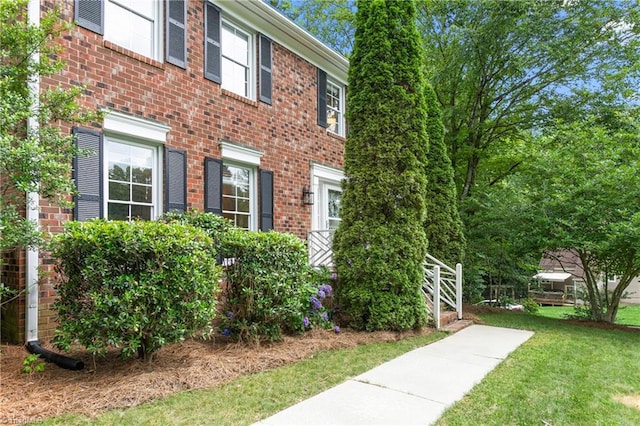 3717 Rock Haven Dr, Greensboro, NC 27410 - view of front of home featuring brick siding and a front lawn