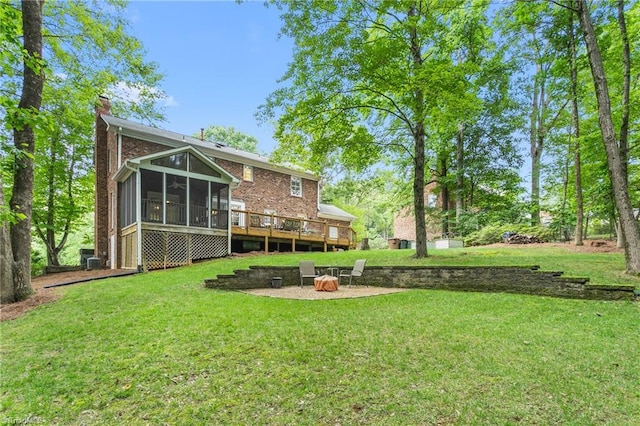 3717 Rock Haven Dr, Greensboro, NC 27410 - view of grassy yard with a sunroom and a deck