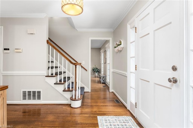3717 Rock Haven Dr, Greensboro, NC 27410 - foyer featuring wood finished floors, ornamental molding, and stairs