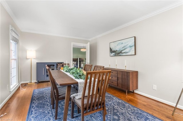 3717 Rock Haven Dr, Greensboro, NC 27410 - dining room featuring wood finished floors and crown molding