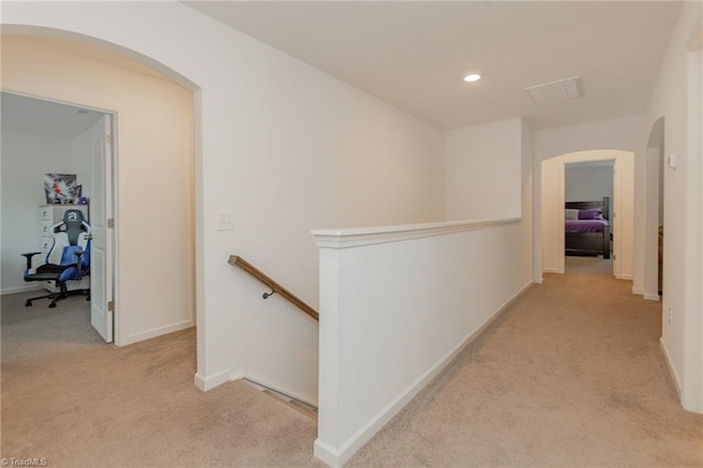 5968 Crescentbrook Ln, Clemmons, NC 27012 - hallway featuring an upstairs landing, arched walkways, carpet, baseboards, and recessed lighting
