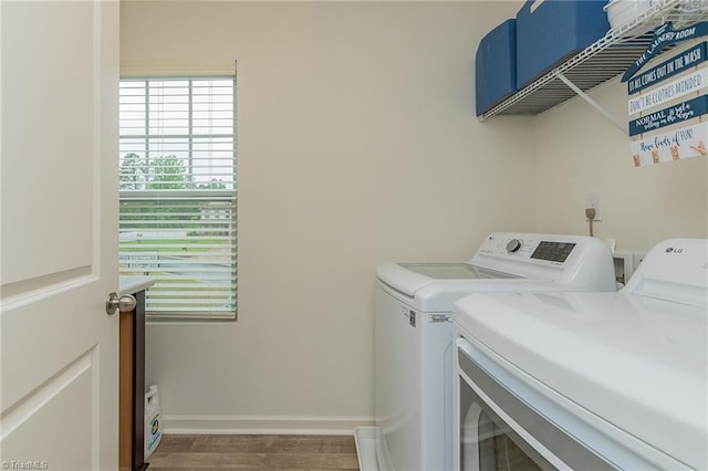 5968 Crescentbrook Ln, Clemmons, NC 27012 - laundry room featuring independent washer and dryer, wood finished floors, and baseboards