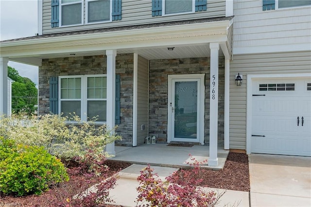 5968 Crescentbrook Ln, Clemmons, NC 27012 - view of exterior entry with stone siding and covered porch