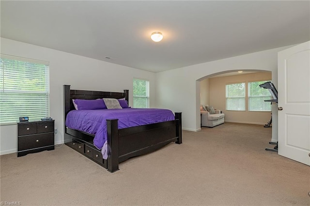5968 Crescentbrook Ln, Clemmons, NC 27012 - carpeted bedroom with arched walkways and baseboards