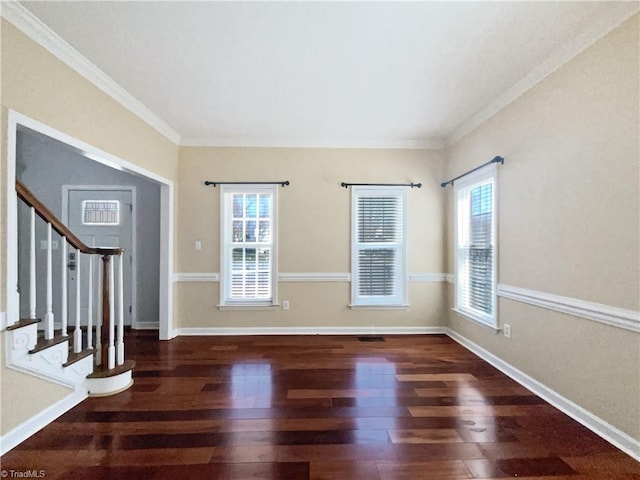 foyer entrance with stairway, plenty of natural light, baseboards, and wood finished floors