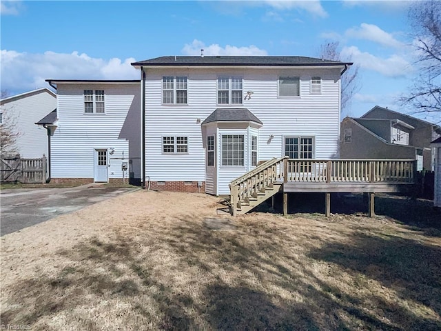 back of house featuring a deck, stairs, and crawl space