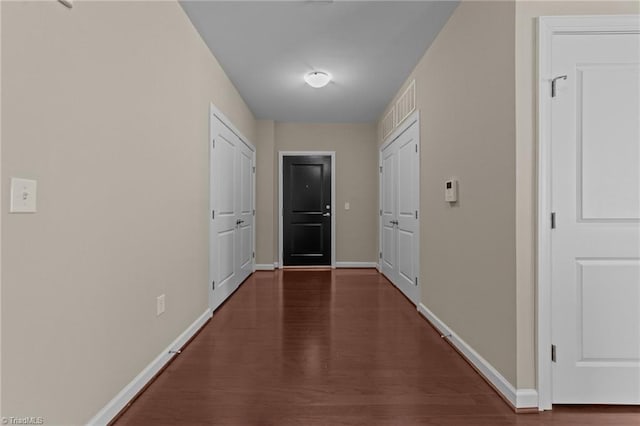 201 N Elm St Unit 703, Greensboro, NC 27401 - hallway with baseboards and wood finished floors