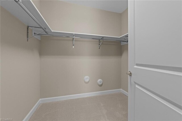 201 N Elm St Unit 703, Greensboro, NC 27401 - walk in closet featuring carpet flooring