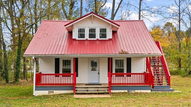 view of front facade with a porch and a front yard