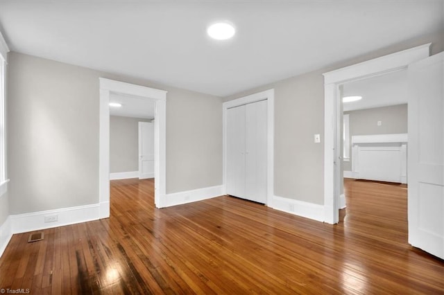 spare room with hardwood / wood-style flooring