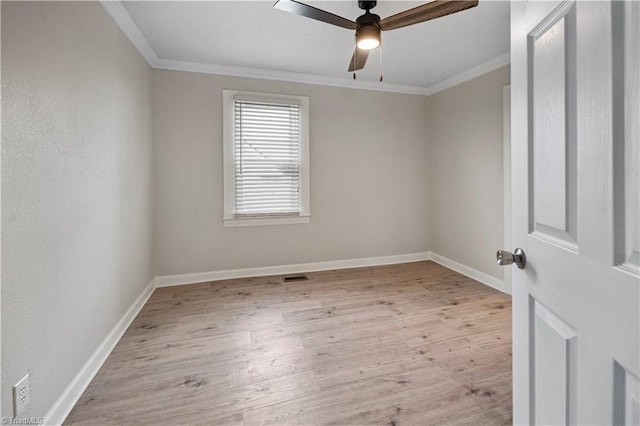 unfurnished room featuring ceiling fan, light hardwood / wood-style flooring, and crown molding