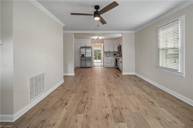 unfurnished living room with ornamental molding, light hardwood / wood-style floors, and ceiling fan