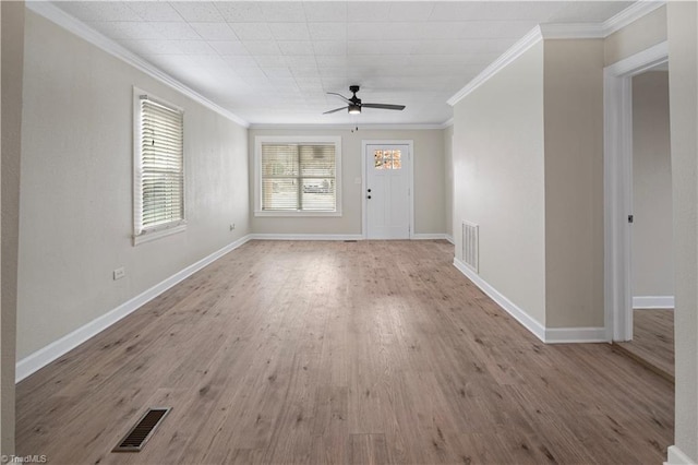 foyer featuring ceiling fan, light wood-type flooring, and crown molding