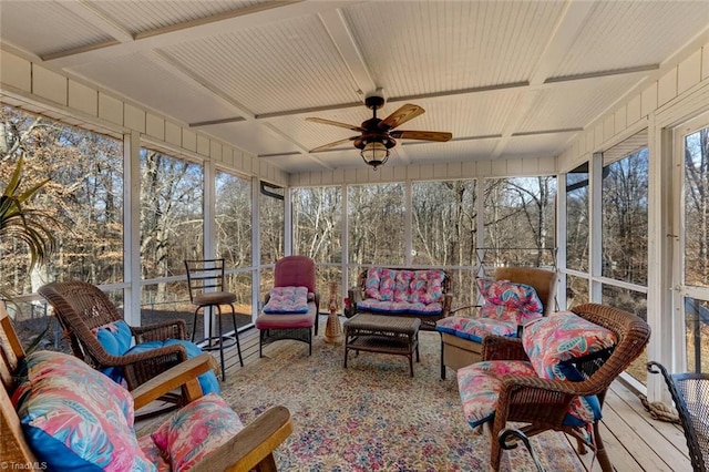 sunroom / solarium featuring coffered ceiling and ceiling fan