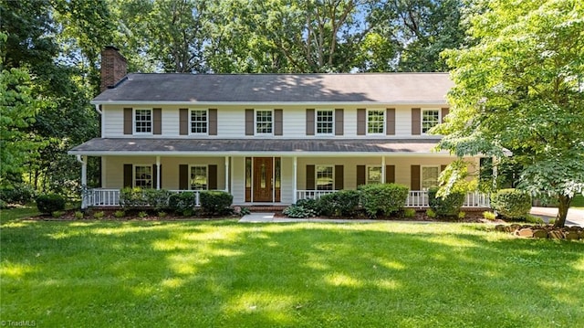 2424 Limner Ln, Winston-Salem, NC 27106 - colonial inspired home featuring a chimney, covered porch, and a front lawn