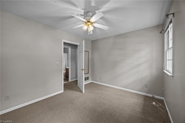 2424 Limner Ln, Winston-Salem, NC 27106 - unfurnished bedroom featuring carpet, baseboards, a textured ceiling, and ceiling fan