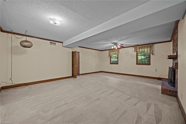 2424 Limner Ln, Winston-Salem, NC 27106 - unfurnished living room with light carpet, crown molding, baseboards, a textured ceiling, and ceiling fan