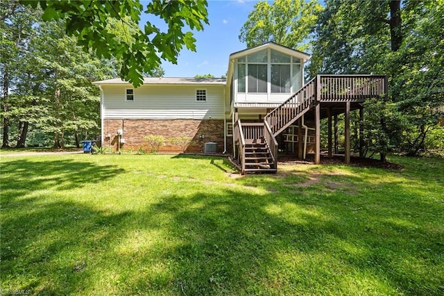 2424 Limner Ln, Winston-Salem, NC 27106 - rear view of property with stairs, a sunroom, a lawn, a wooden deck, and brick siding