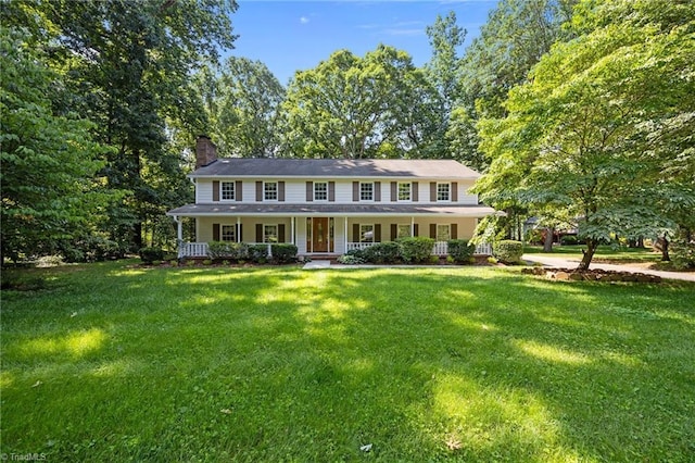 2424 Limner Ln, Winston-Salem, NC 27106 - view of front of house featuring a porch, a chimney, and a front lawn