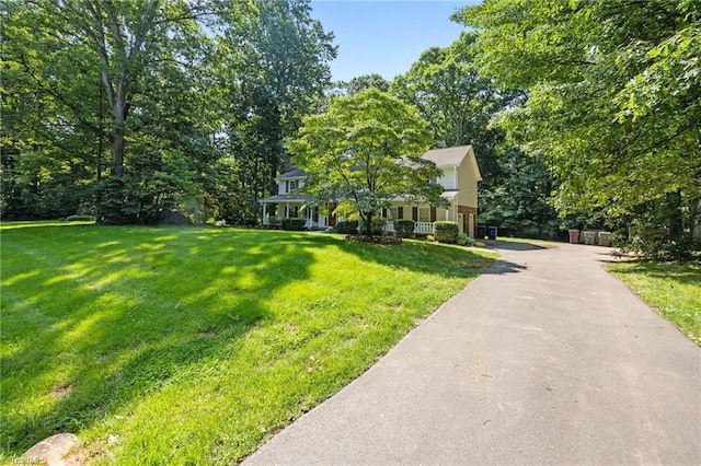 2424 Limner Ln, Winston-Salem, NC 27106 - view of front of home featuring a front lawn, driveway, and covered porch