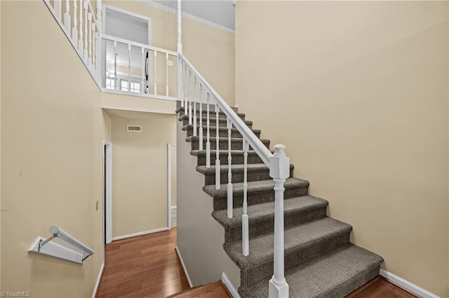 2424 Limner Ln, Winston-Salem, NC 27106 - stairs featuring wood finished floors, baseboards, and crown molding