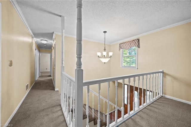 2424 Limner Ln, Winston-Salem, NC 27106 - hallway featuring carpet flooring, ornamental molding, baseboards, a chandelier, and an upstairs landing