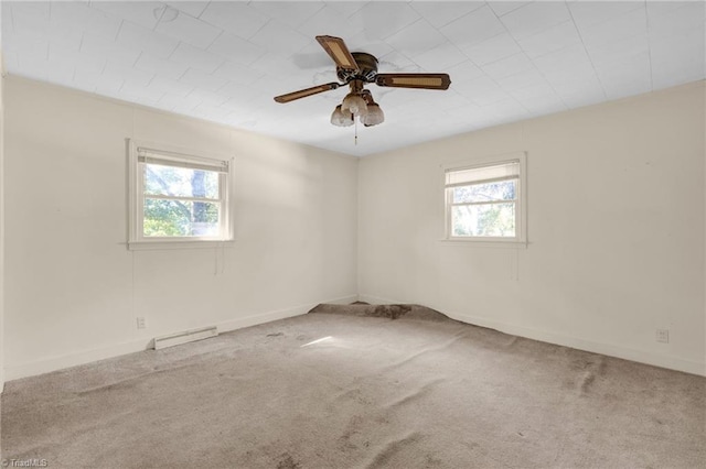 unfurnished room featuring a baseboard radiator, carpet floors, and ceiling fan