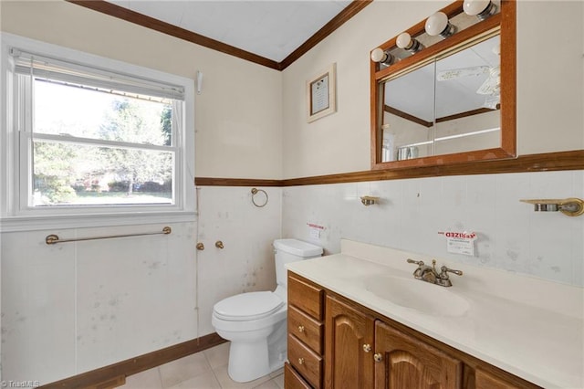 bathroom featuring vanity, ornamental molding, toilet, and tile patterned flooring