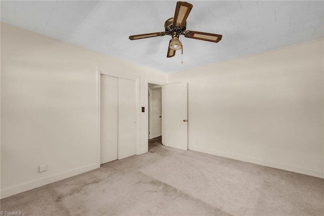 spare room with light carpet and ceiling fan