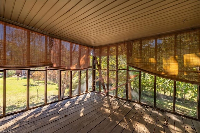 unfurnished sunroom with wooden ceiling